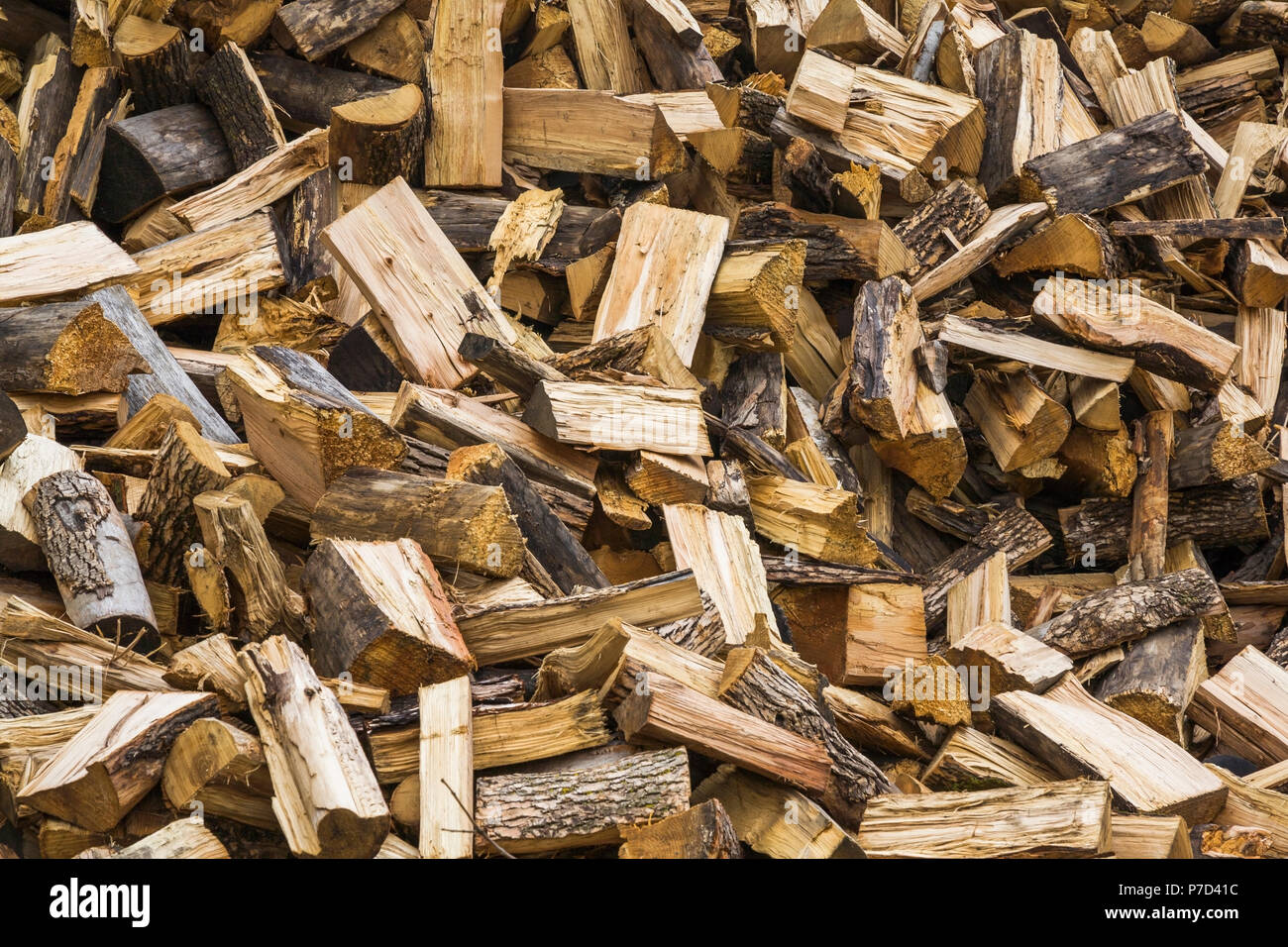 Pile of cut and split firewood, background image Stock Photo - Alamy