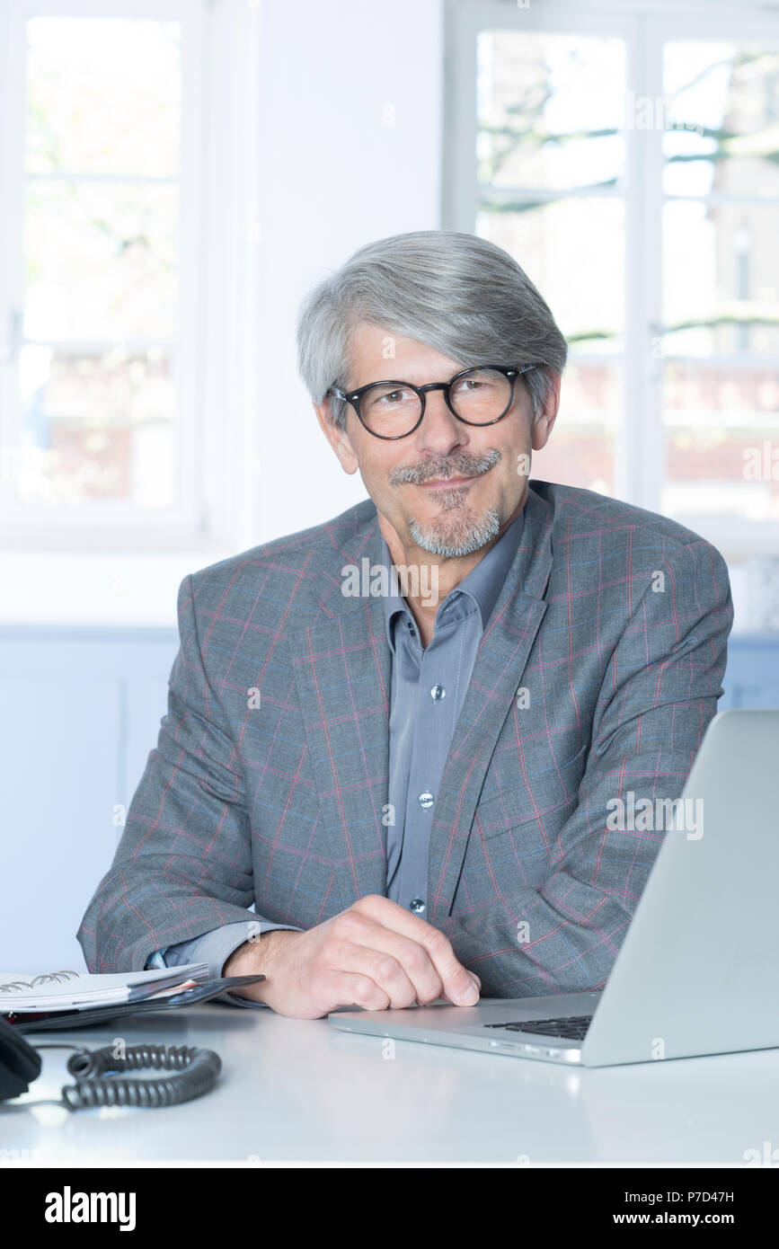 Man working at the laptop in the office Stock Photo