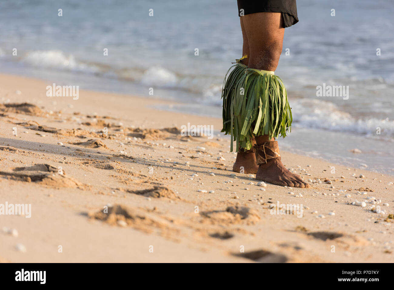Male fire dancer performing at the beach Stock Photo