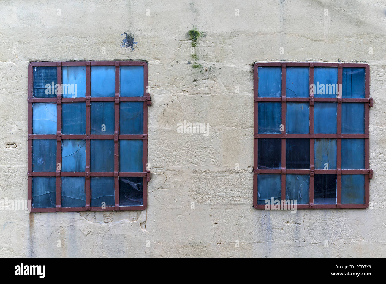 Barred windows of an old factory building, Bavaria, Germany Stock Photo