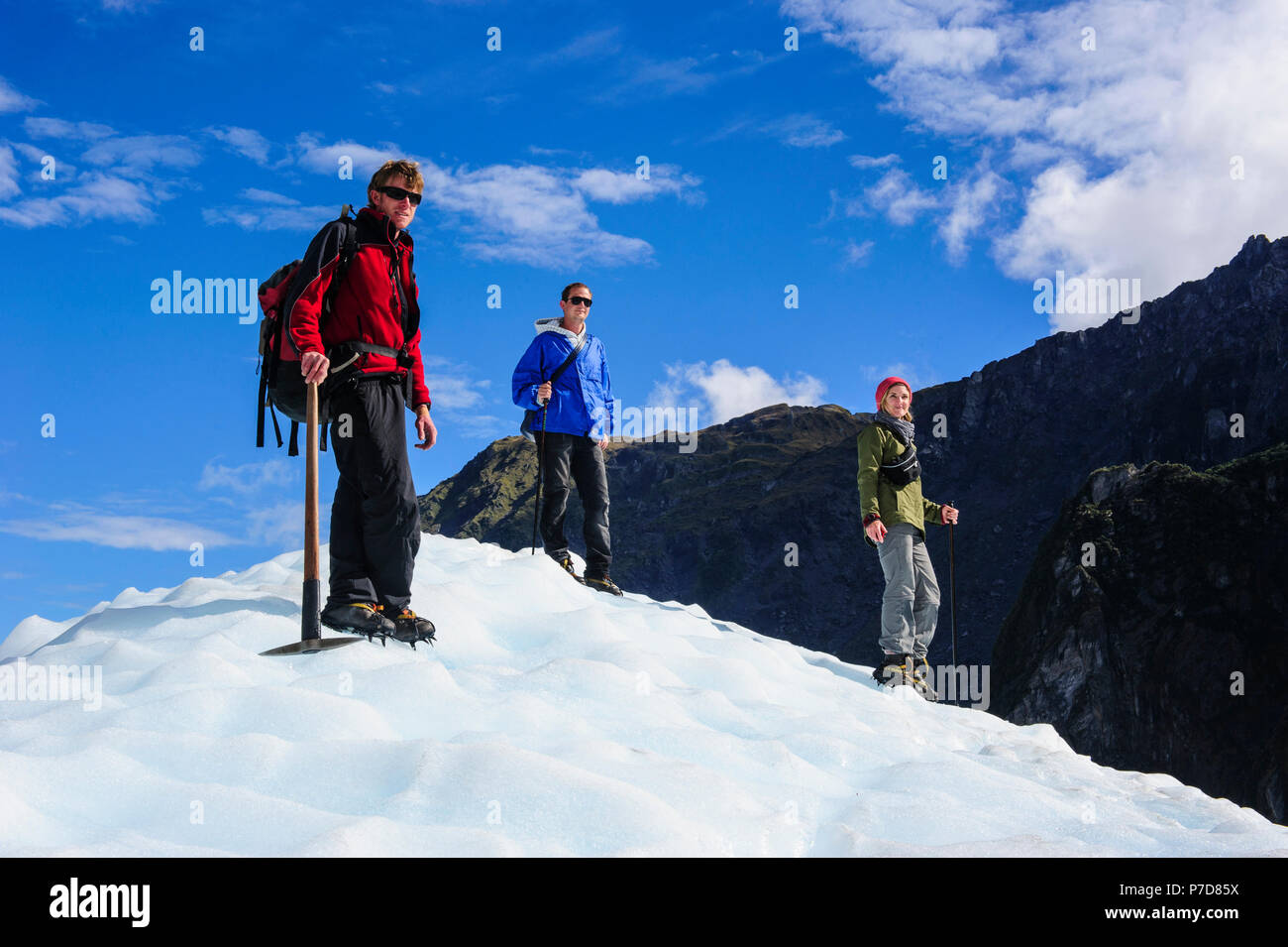 Tourists standing on the icefield of the Fox Glacier, South Island, New Zealand Stock Photo