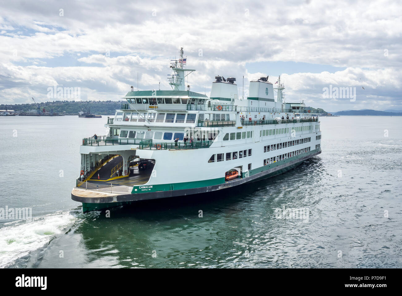 Washignton State ferry boat leaves the Seattle terminal to reach Bremerton across the Puget Sound, WA, USA. Stock Photo