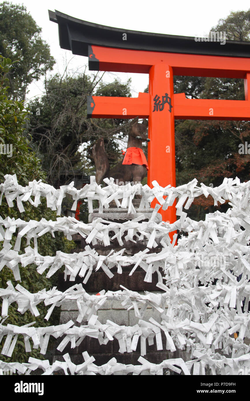 Paper prayers, Fushimi Inari-taisha Shinto shrine, Kyoto, Japan Stock Photo