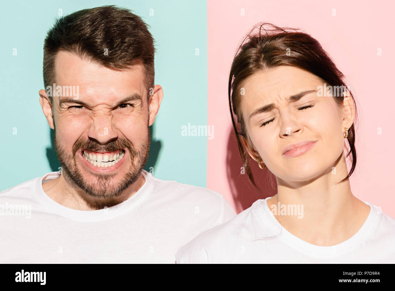 Closeup portrait of young couple, man, woman. One being excited happy ...
