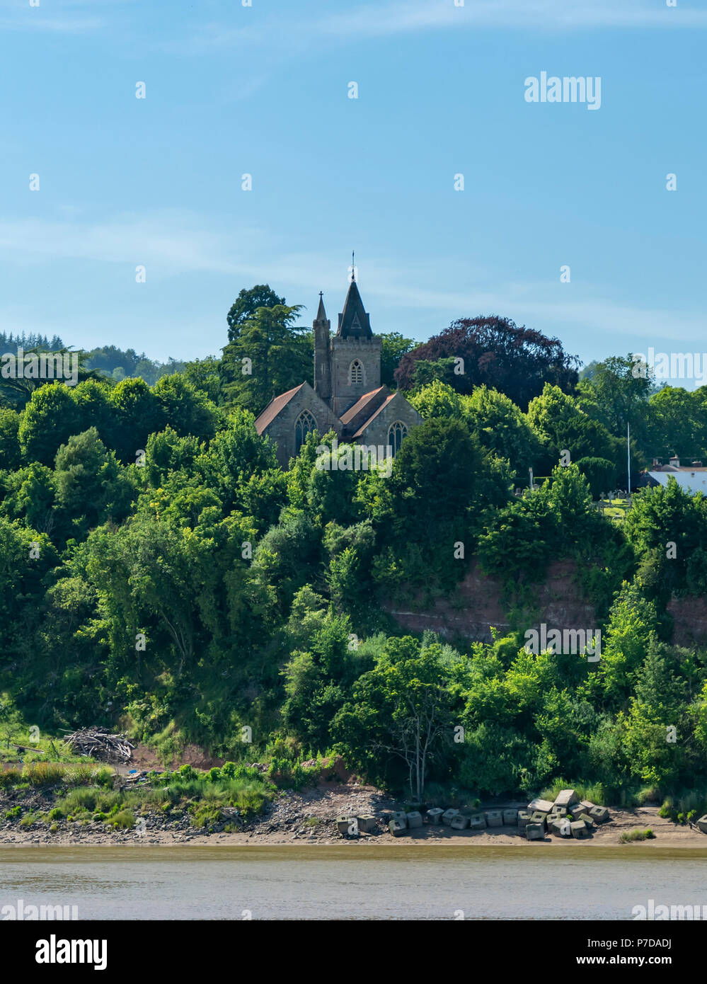 The Church of St Peters in Newnham on Severn as seen from the New Passage side of the River Severn, UK Stock Photo