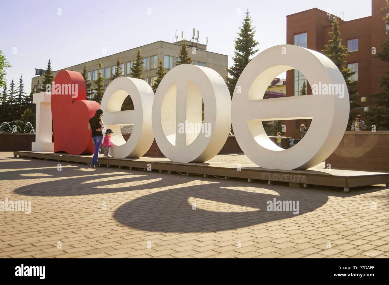 Letters of the Bashkir alphabet make up the name of the city: 'Ufa'. The Square of two fountains, Ufa, Bashkortostan, Russia, May 2016. Ufa city stock Stock Photo
