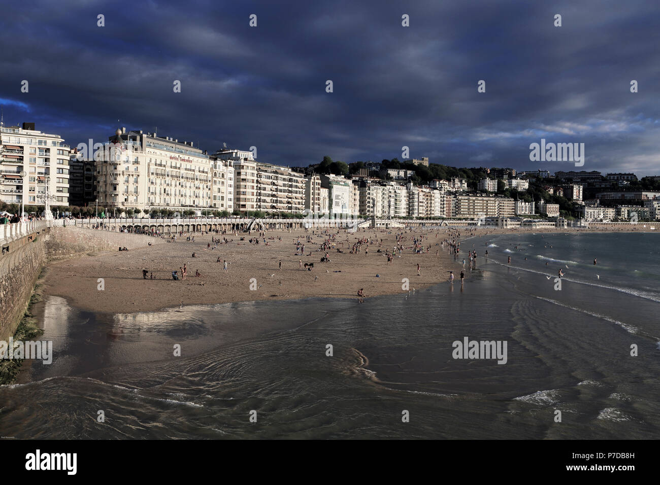 Crowded beach during summer in San Sebastian, Spain Stock Photo