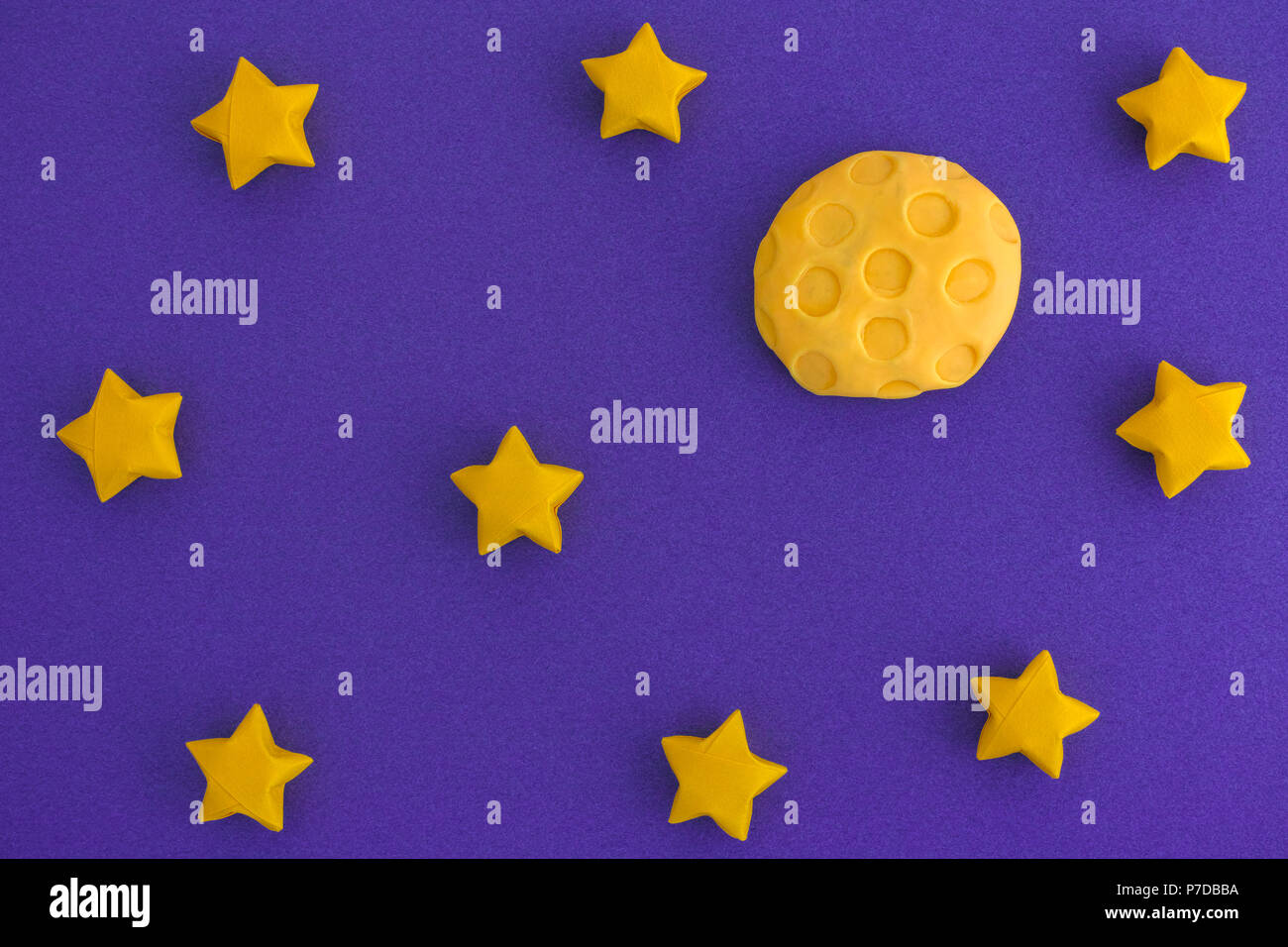 The Moon and The Starry Sky at Night. The Moon is made out of play clay (plasticine). Stock Photo