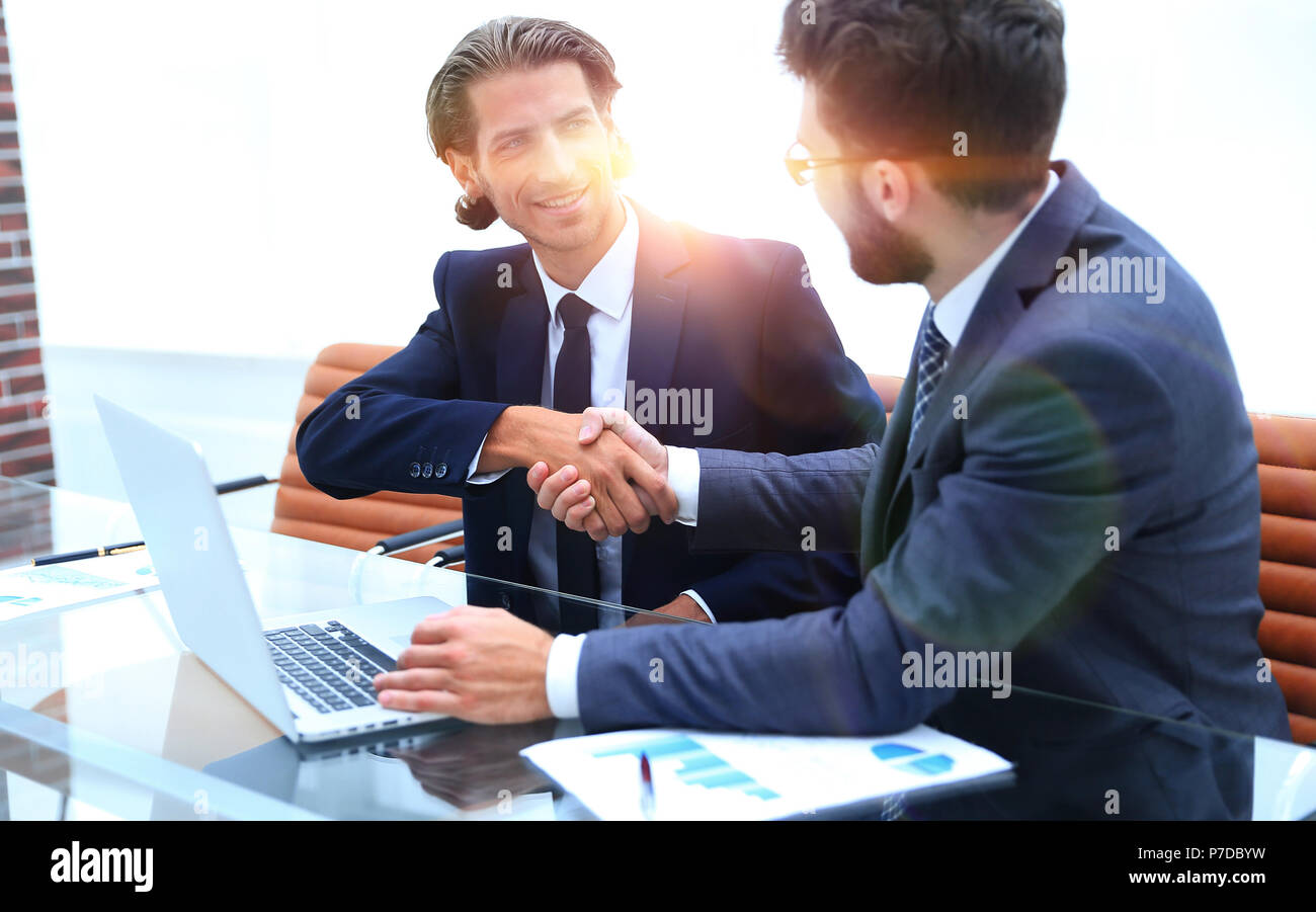 handshake business partners after discussing Stock Photo