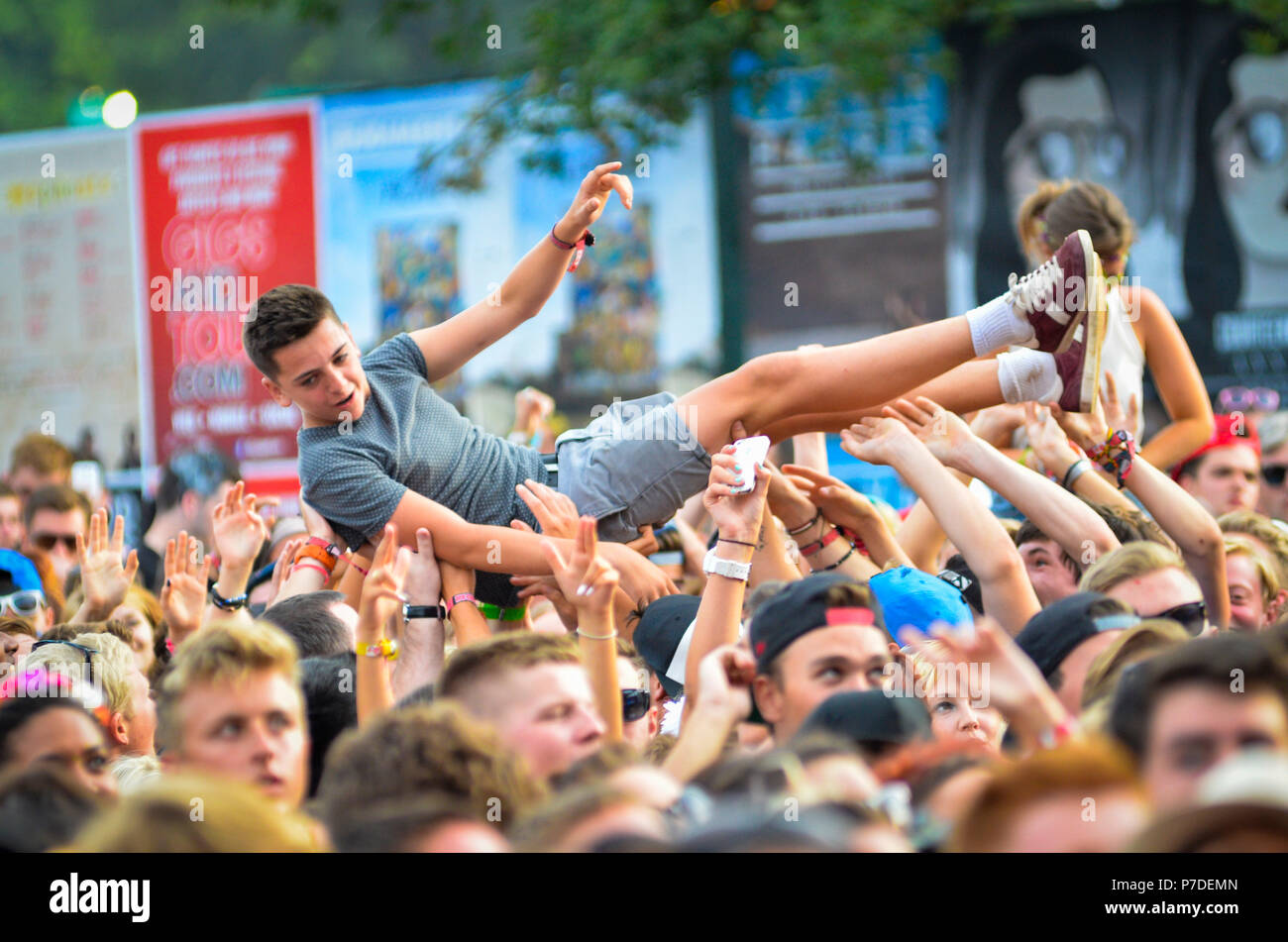 Music Fans Waving Hands in the Air at a Music Festival Stock Photo