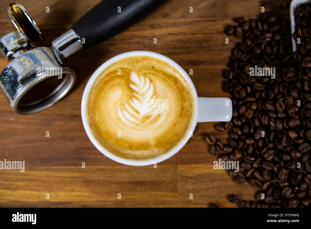 Coffee cup latte art with coffee beans Stock Photo Alamy