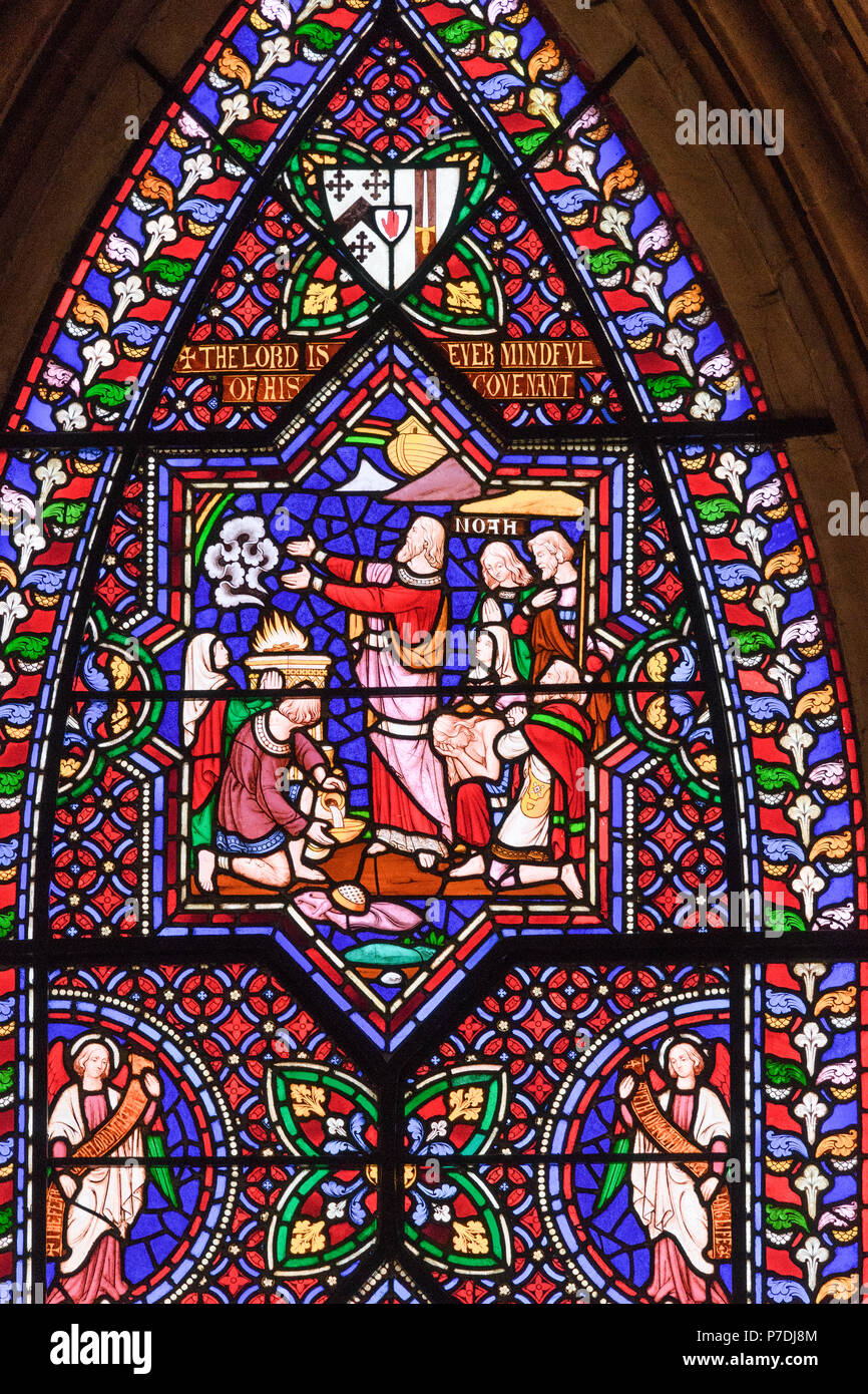 A colorful stained glass window at Lincoln cathedral, England, illustrating, from the Old Testament, Noah's covenant with God Stock Photo