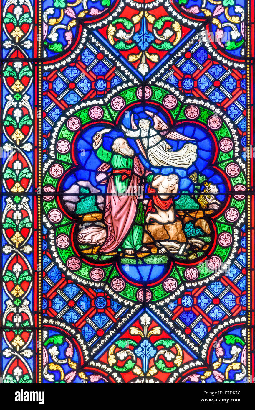 A Colorful Stained Glass Window At Lincoln Cathedral England Illustrating From The Ot An Angel Stopping Abraham Sacrificing His Son Isaac To God Stock Photo Alamy