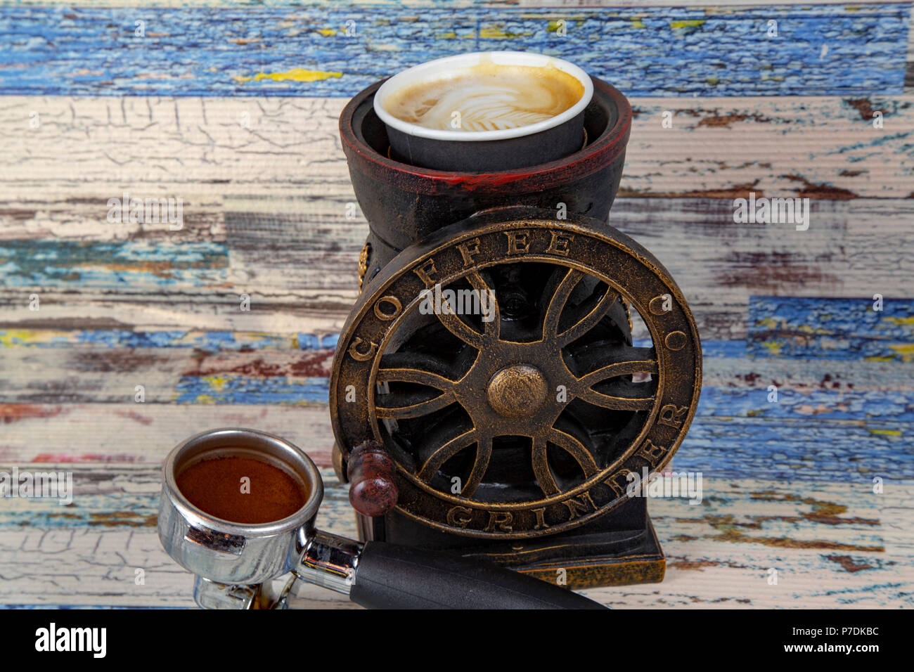 https://c8.alamy.com/comp/P7DKBC/coffee-machine-preparing-fresh-coffee-closeup-of-filter-holder-with-ground-powder-on-bar-coffee-maker-and-pouring-into-white-cup-at-P7DKBC.jpg