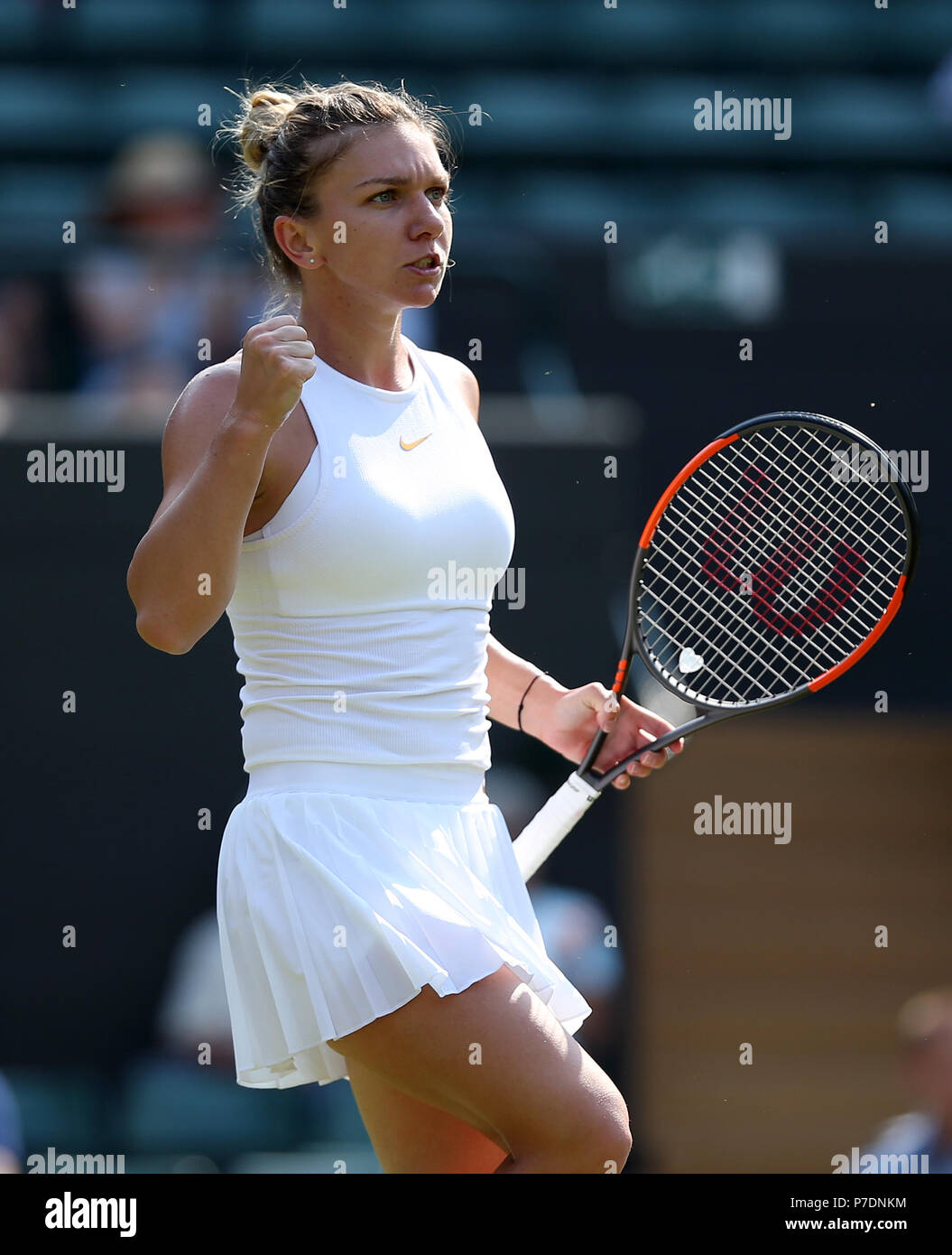 Simona Halep reacts on day four of the Wimbledon Championships at the All England Lawn Tennis and Croquet Club, Wimbledon. Stock Photo