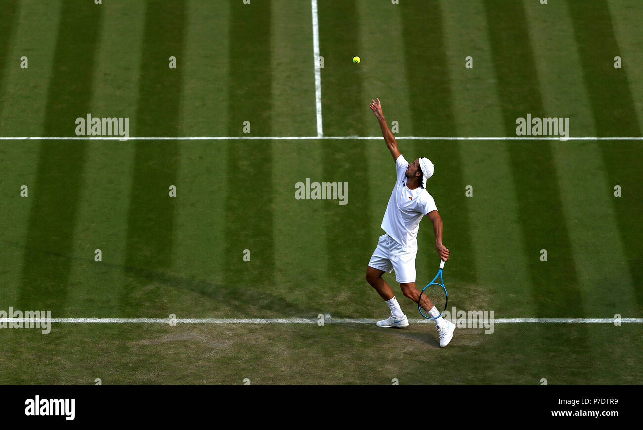 Feliciano Lopez serves on day four of the Wimbledon Championships at the All England Lawn Tennis and Croquet Club, Wimbledon. Stock Photo