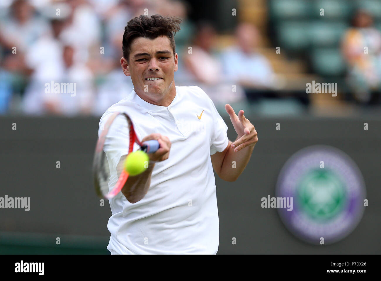 Taylor Fritz in action on day four of the Wimbledon Championships at