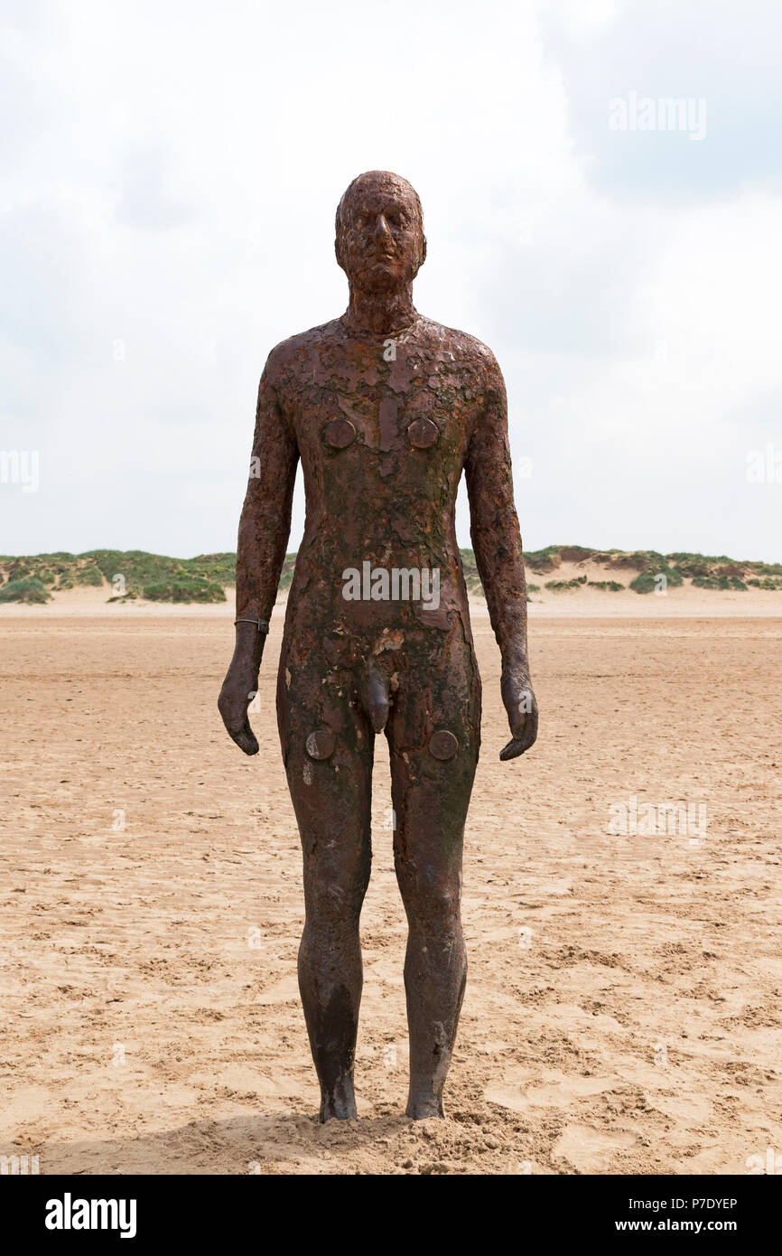 Another Place a modern art installation on crosby beach, liverpool, uk.by sculptor Antony Gormley Stock Photo