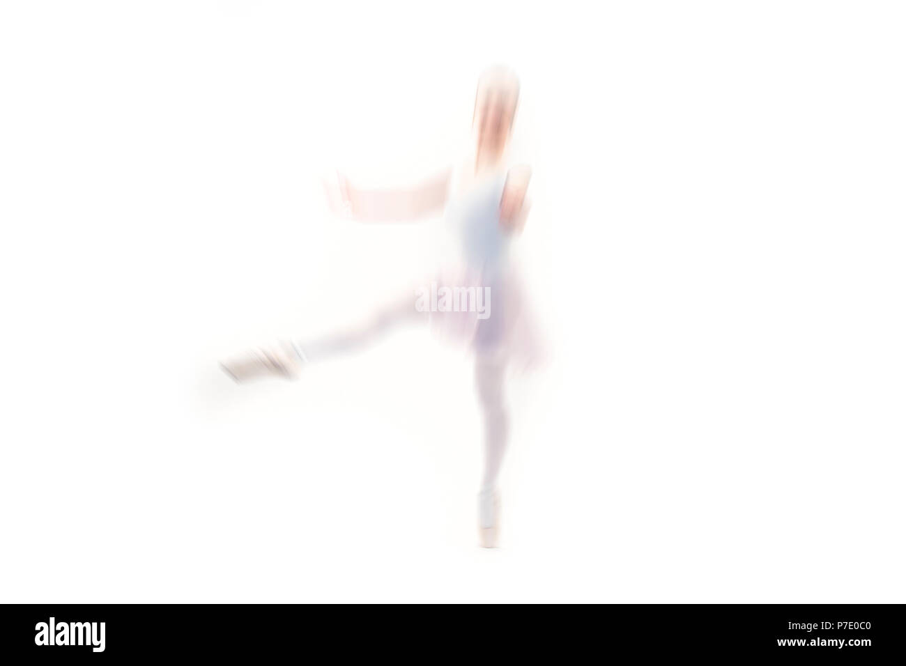 Blurred young ballet dancer posing on white background Stock Photo
