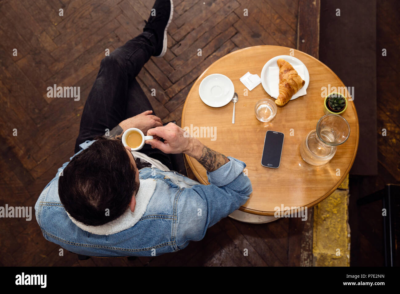 Man having coffee in cafe Stock Photo