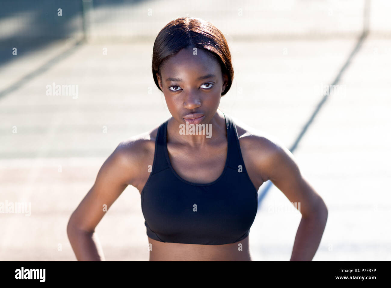 Young woman in sports bra Stock Photo