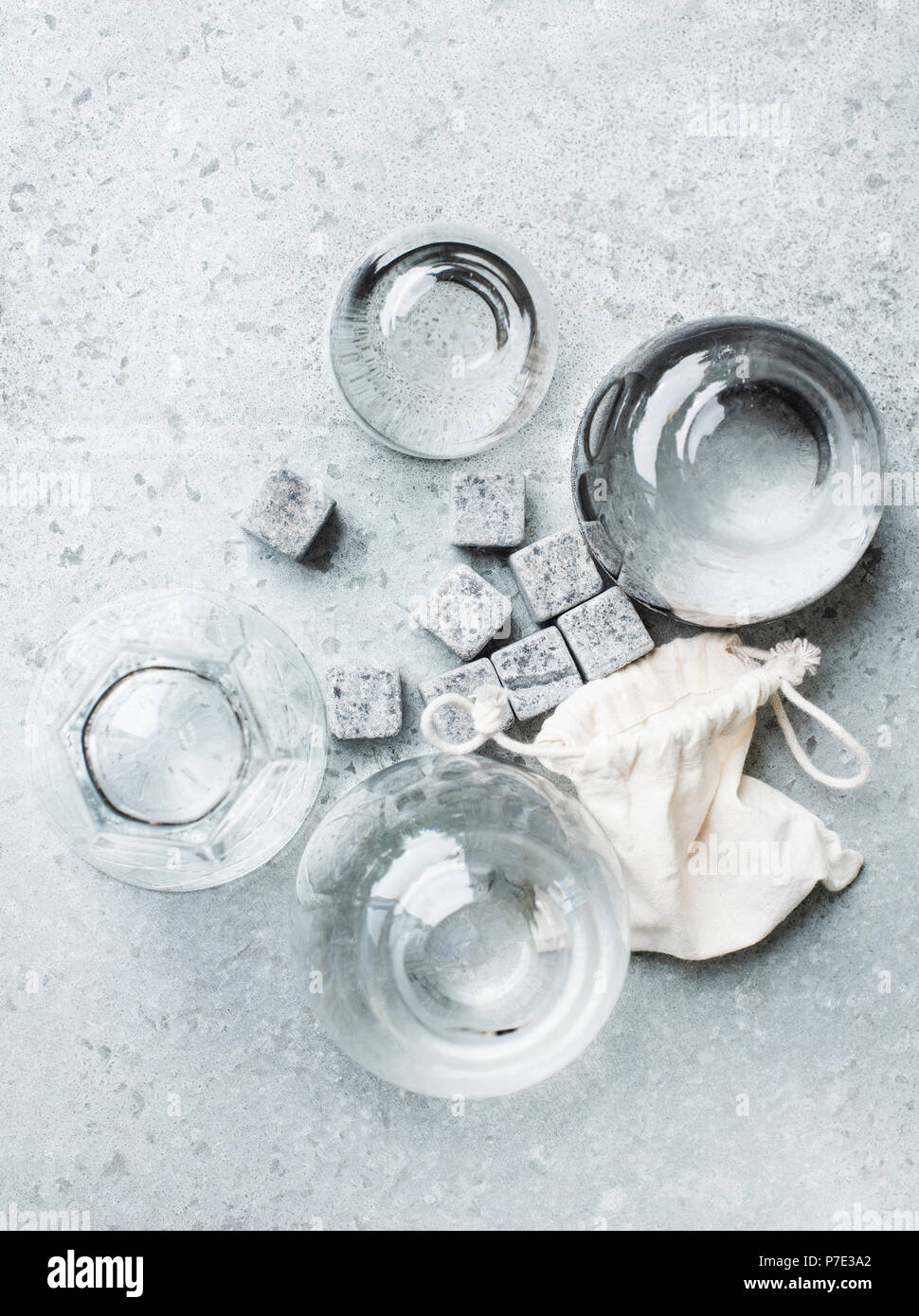 Empty glasses and whiskey stones, overhead view Stock Photo