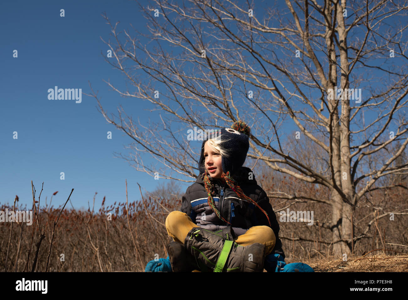 Boy outdoors, wearing winter clothing Stock Photo