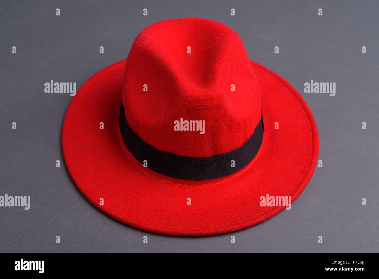 Red Hat Against Gray Background Stock Photo