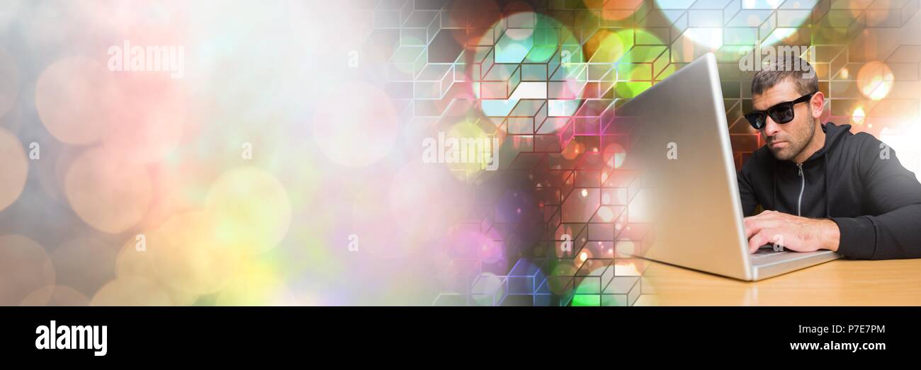 Man with sunglasses using laptop with geometric transitions Stock Photo