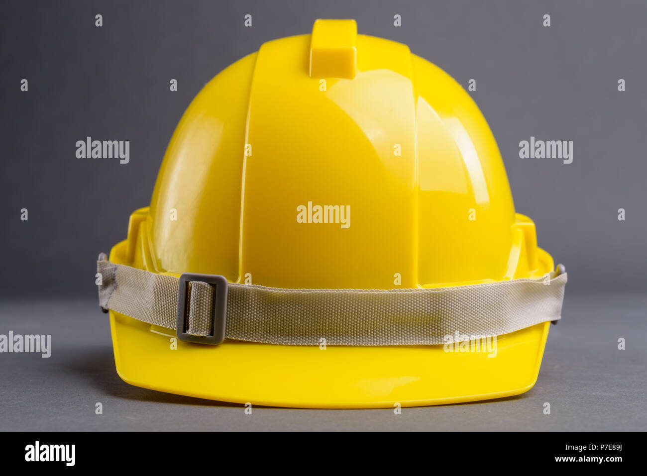 Studio Shot Of Construction Helmet Against Gray Background Stock Photo