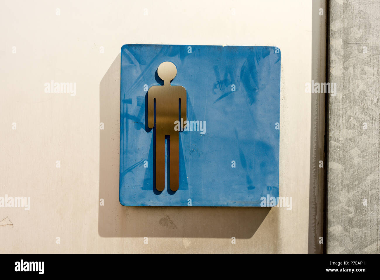toilet sign man old in washed out blue Stock Photo - Alamy