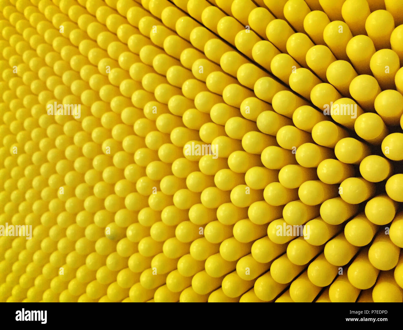 Abstract dots background in yellow colors. Yellow is the color of sunshine. It's associated with joy, happiness, intellect, and energy. produces a war Stock Photo