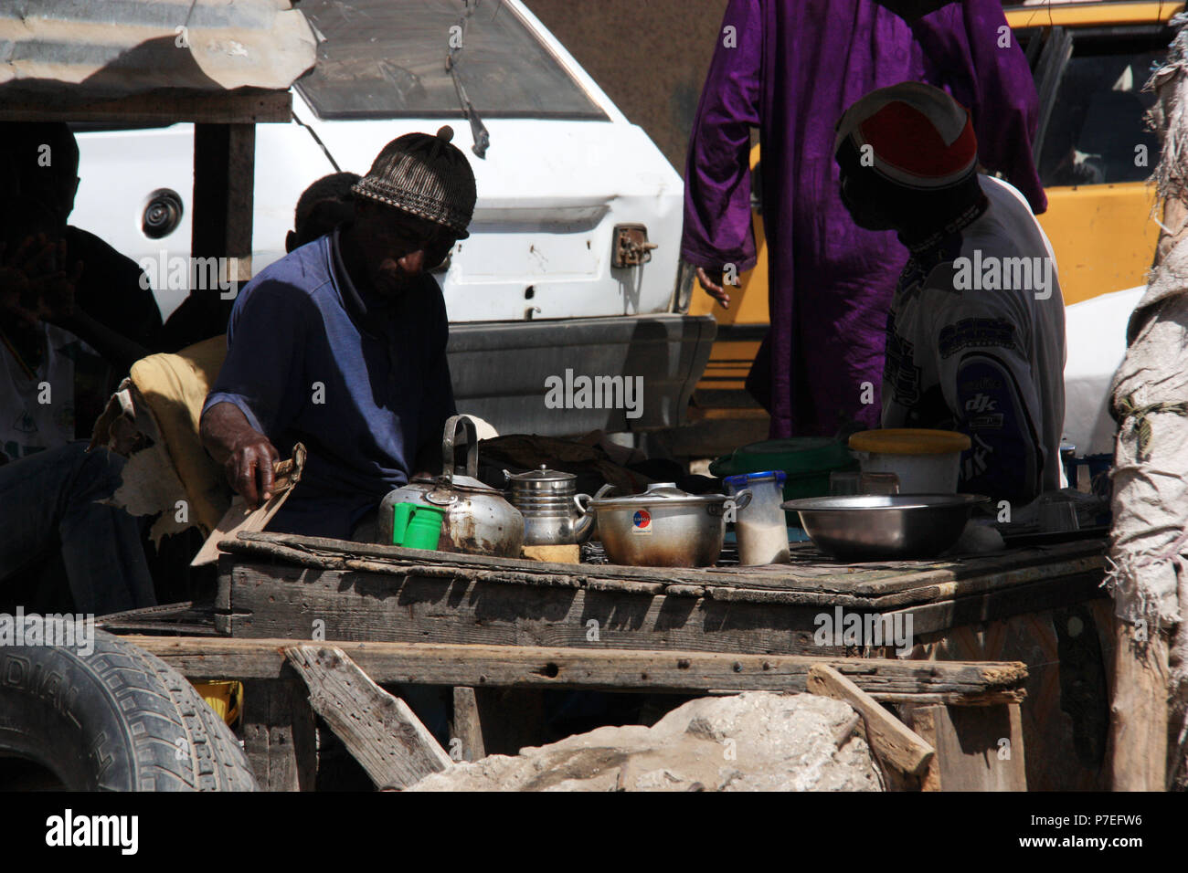 Improvisational tea and coffee stall next to a bus stop in Saint-Louis-du-Sénégal's city center Stock Photo