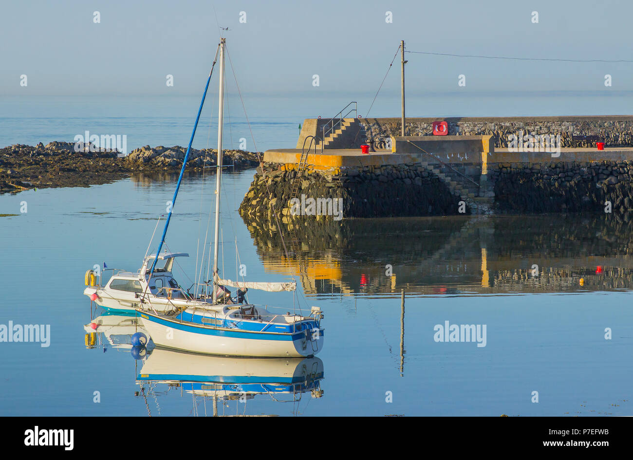 29 June 2018 Small pleasure boats and yachts on their moorings on a beautiful summer evening in Groomsport Village Harbour Co Down Northern Ireland Stock Photo