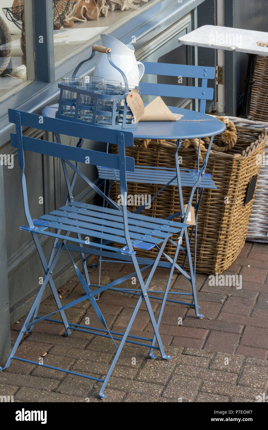 shabby chic style folding garden tables and chairs. Stock Photo