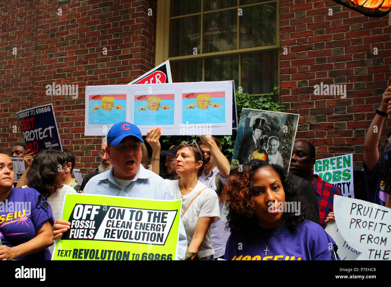 NEW YORK, NY - JUNE 21: Rise and Resist activists gathered in front of the Harvard Club to protest EPA Administrator Scott Pruit who was about to give Stock Photo