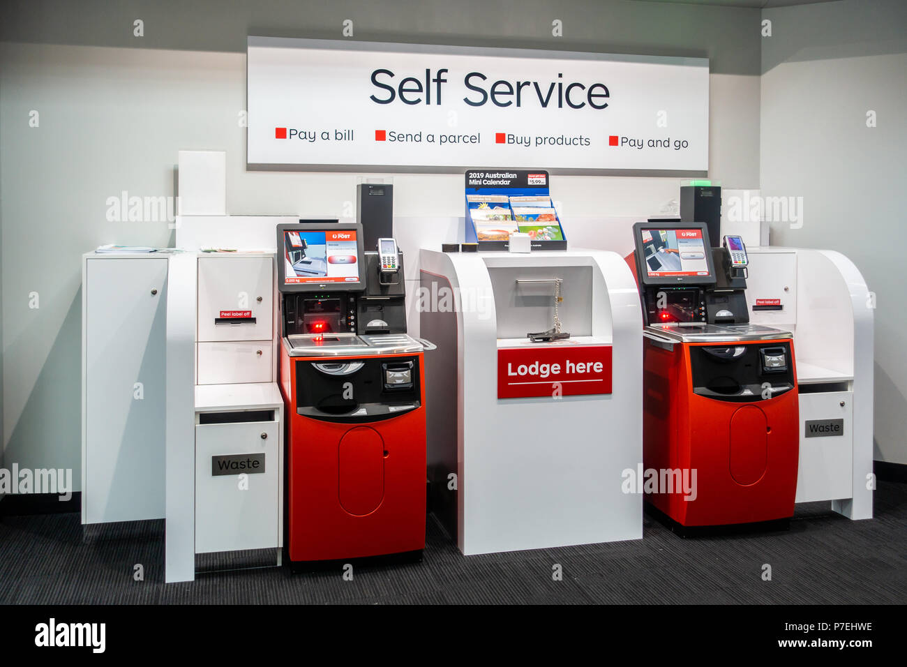 Self Service kiosk machines in post office of Australia Post. Melbourne, VIC Australia. Stock Photo