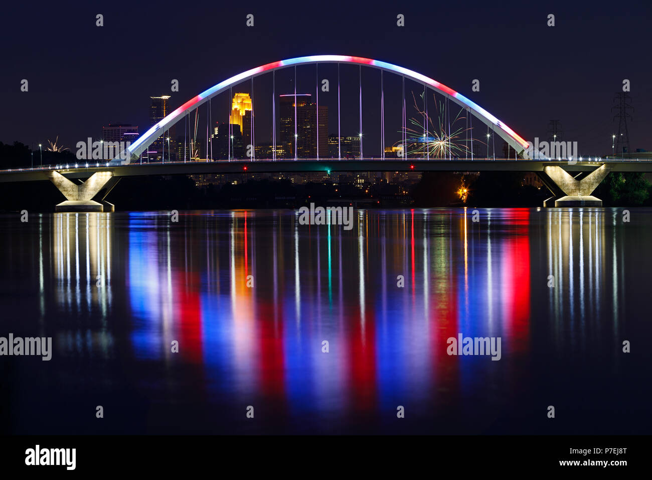The Lowry Avenue Bridge reflects its red, white, and blue colors off
