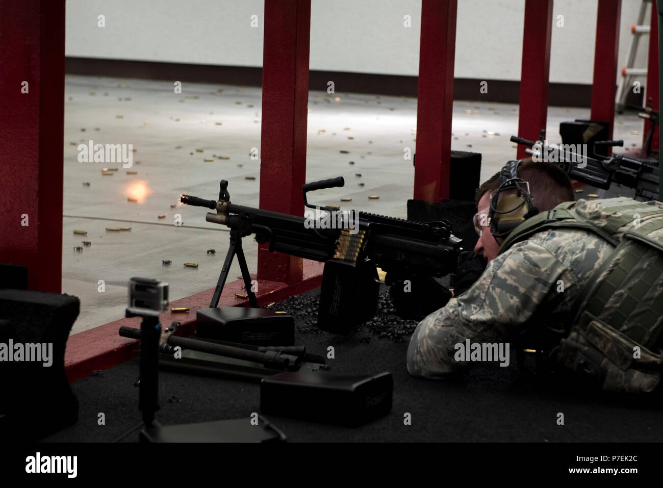 Staff Sgt. Daniel Lanata, 374th Security Forces Squadron 2018 Security Forces Advanced Combat Skills Assessment team member, fires the M249 light machine gun during training, May 31, 2018, at Yokota Air Base, Japan. The 374 SFS team practiced firing the various weapons including the M4 carbine assault rifle, M9 pistol and the M249 light machine gun in preparation for the 2018 ACSA competition at Andersen Air Force Base, Guam. (U.S. Air Force photo by Senior Airman Donald Hudson) Stock Photo