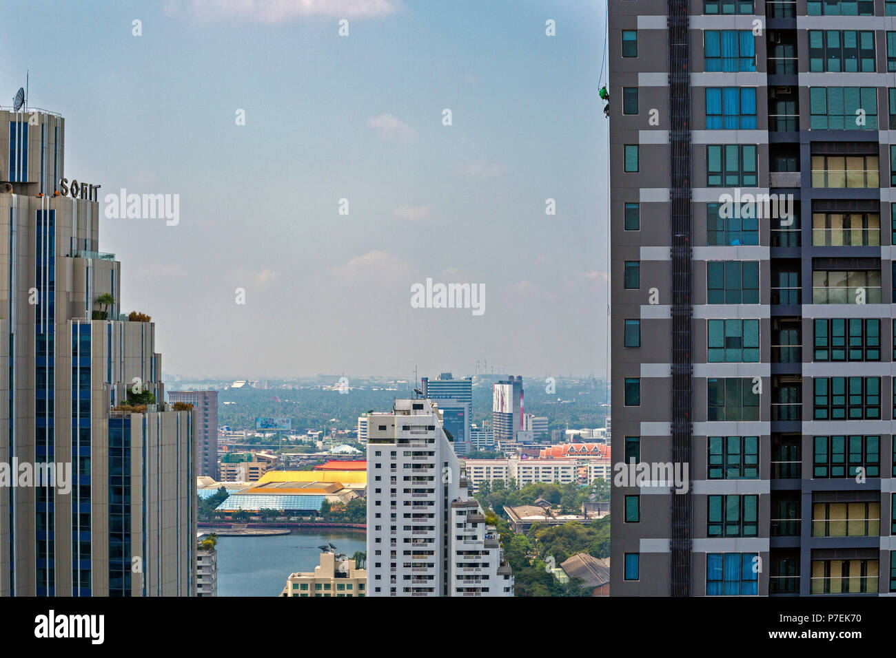 Construction workers working on high rise buildings in Bangkok, Thailand Stock Photo