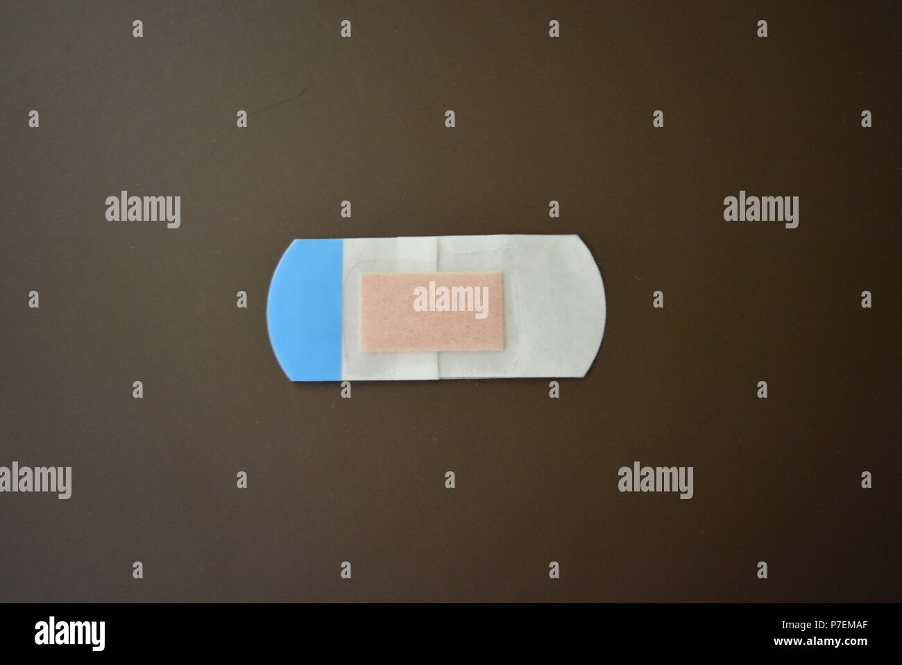 White Bactericidal Plaster For Wounds On Brown Matte Background Stock Photo Alamy