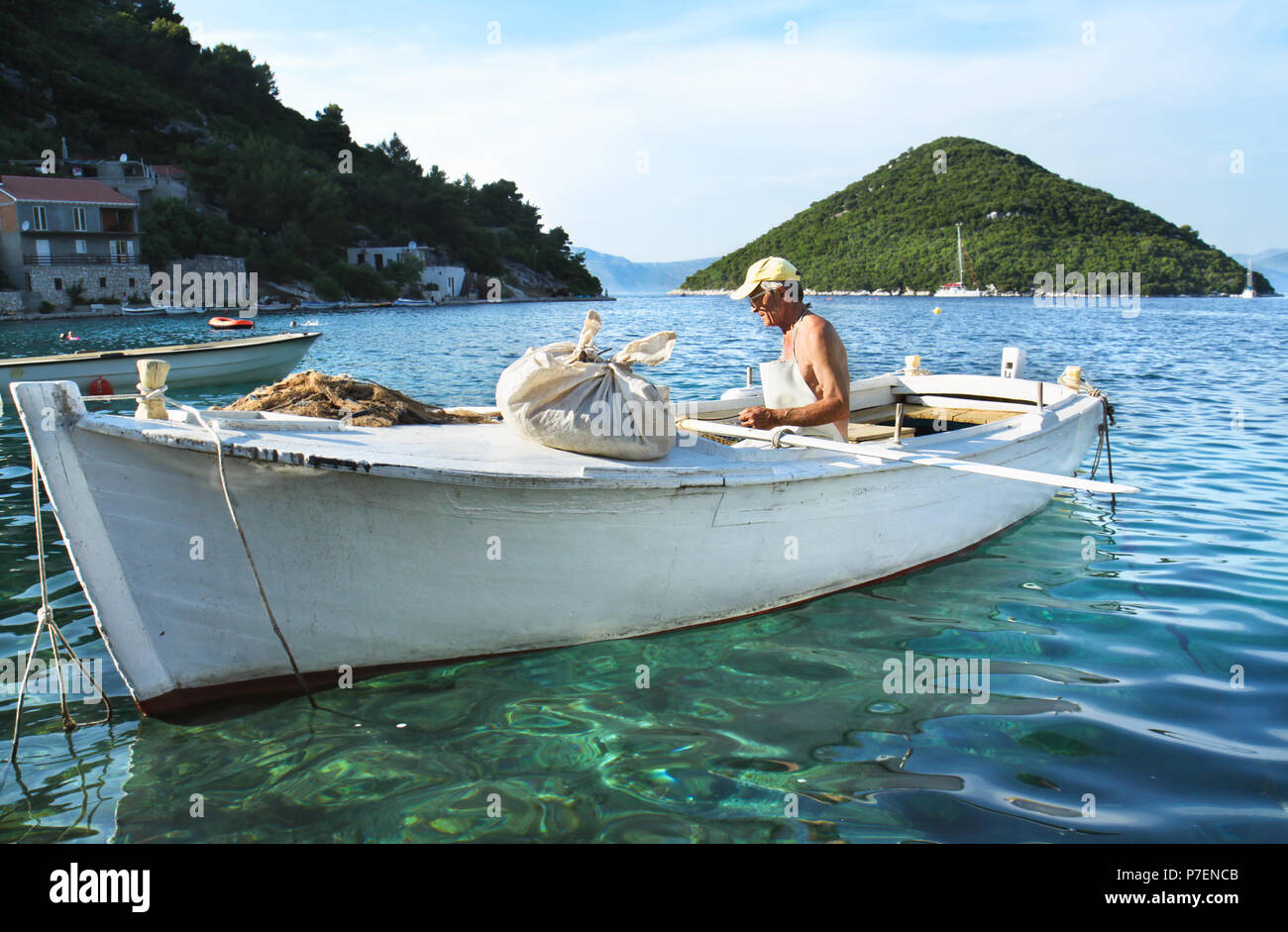 MJET, CROATIA - JULY 13 : Fishing in wooden boat at Adriatic sea by local fishermen July 13, 2010 in Mljet, Croatia Stock Photo
