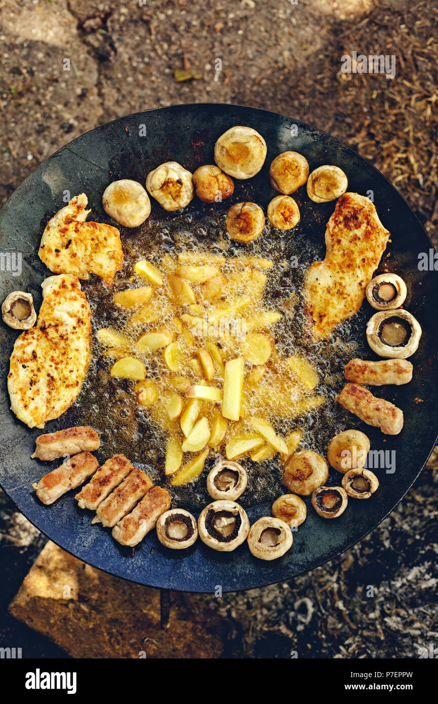 Top view of barbecue grill with various kinds of juicy meat with French  fries for party Stock Photo - Alamy