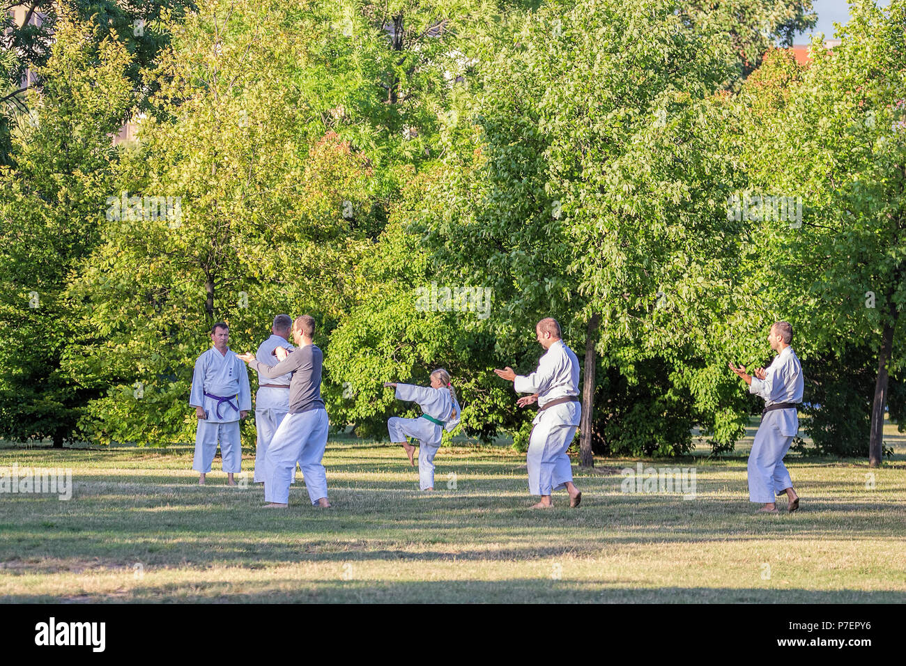 Prague, Czech Republic - July 25, 2017: people doing  sports, training  karate,  in famous Prague public park Letna in the center of Prague. Stock Photo