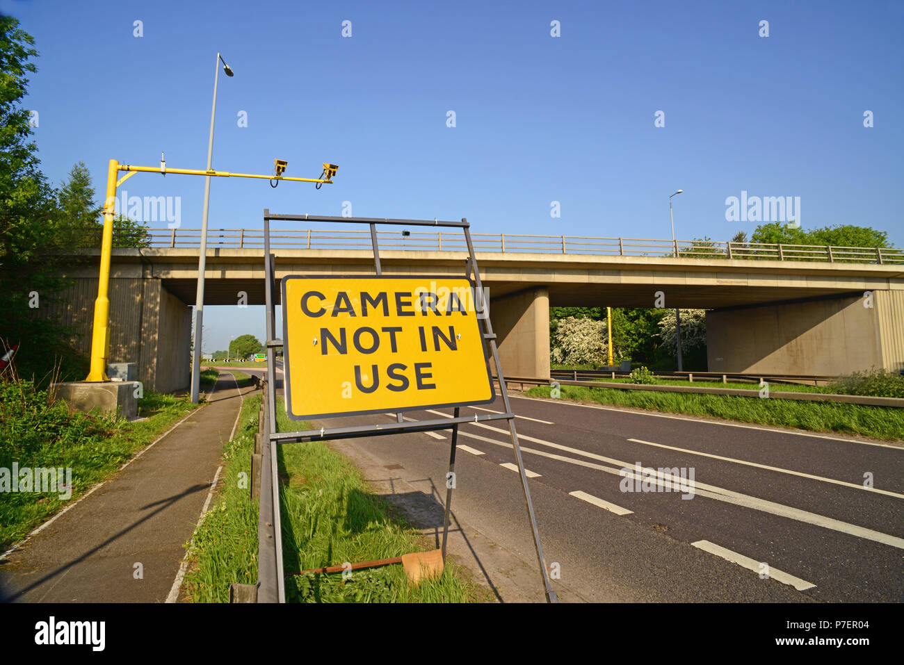 average speed camera not in use warning sign on empty road at roadworks for traffic on the A64 york yorkshire united kingdom Stock Photo