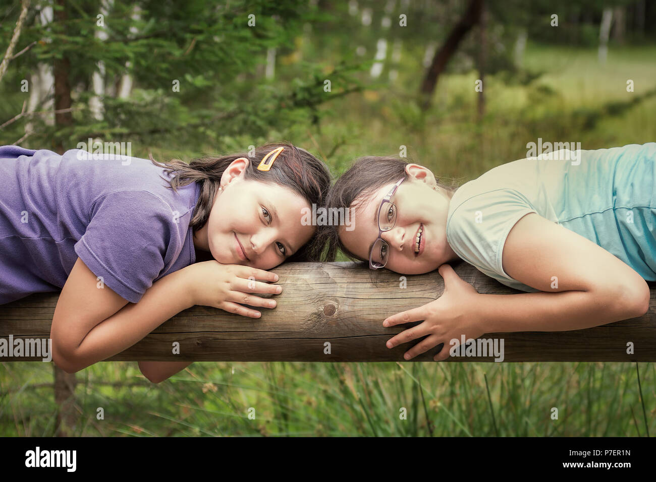 Portrait of two children, girls, sisters in nature. Concept of family life. Stock Photo