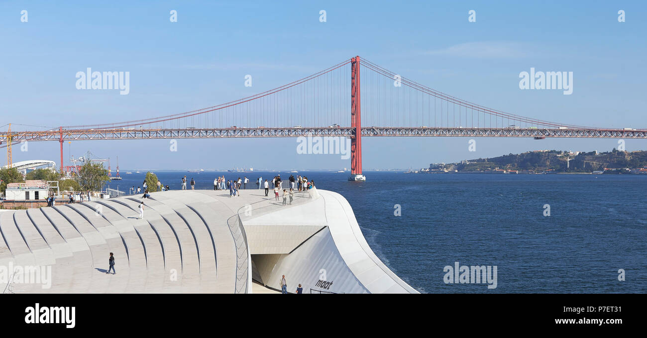 Vantage point of roof terrace, river and Ponte 25 de Abril. MAAT, Lisbon, Portugal. Architect: A LA, 2016. Stock Photo