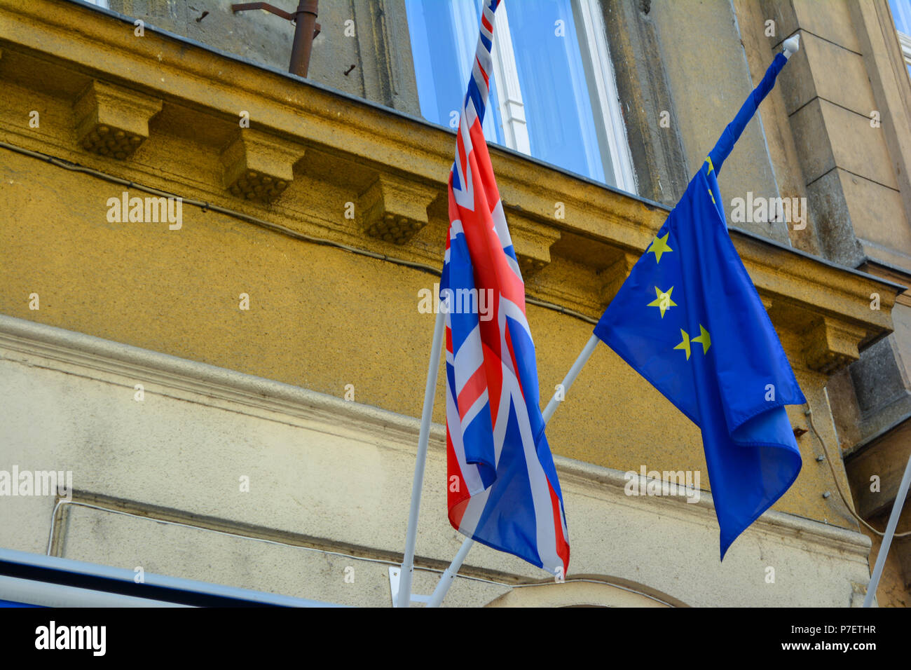 EU and UK flags coalition together. European Union and United Kingdom flags next to each other. Stock Photo
