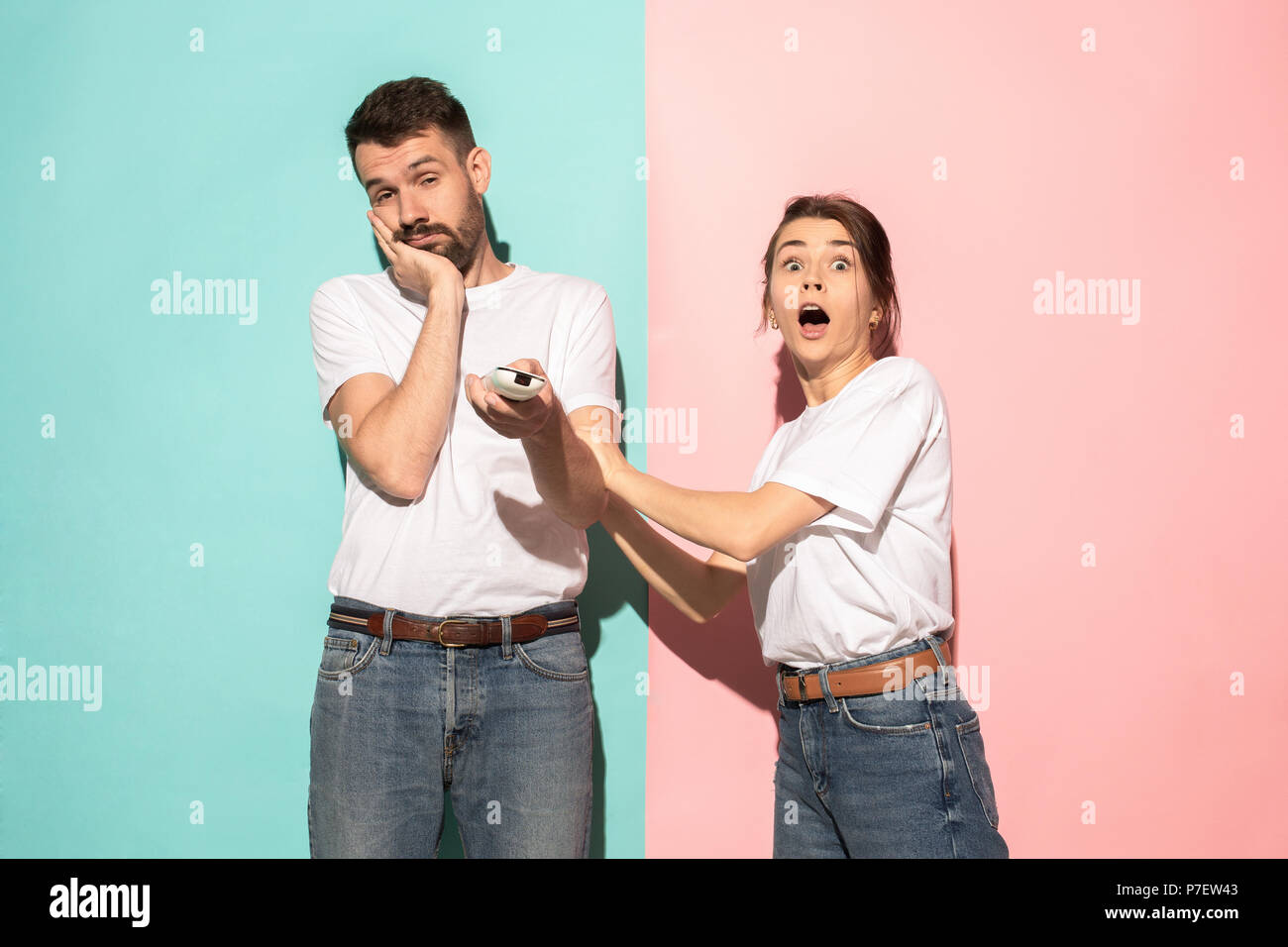 Closeup portrait of young couple, man, woman. One being excited happy ...