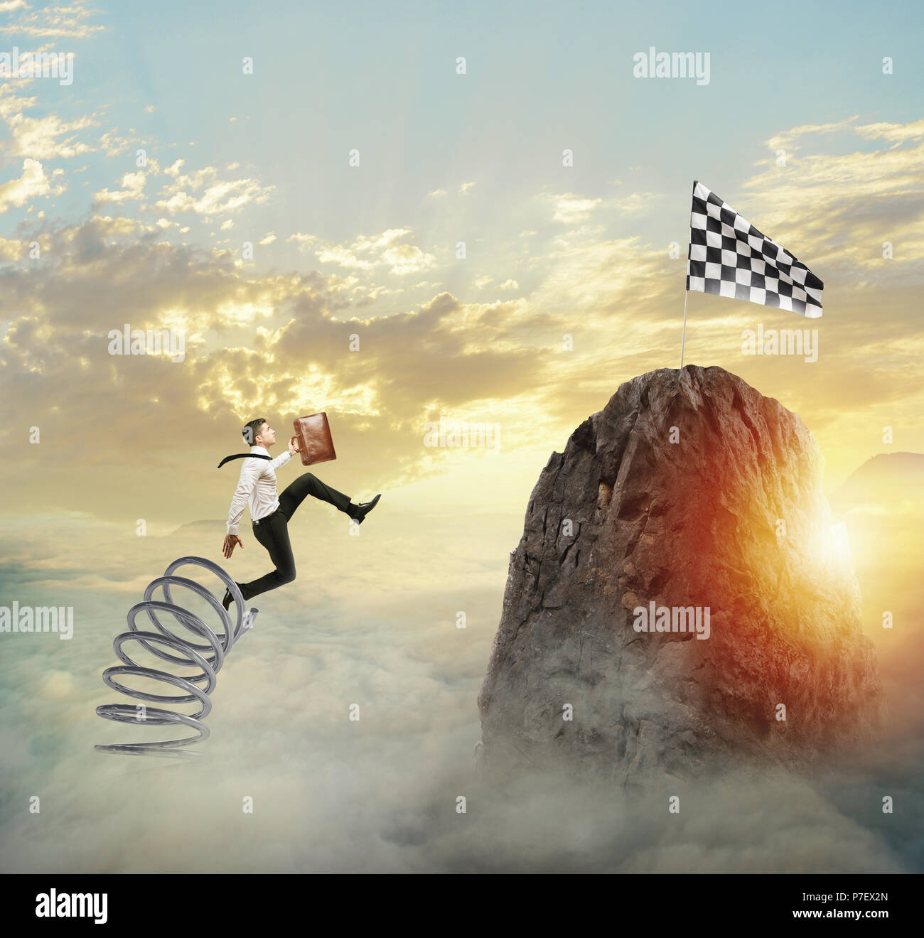 Businessman jumping on a spring to reach the flag. Achievement business goal and Difficult career concept Stock Photo